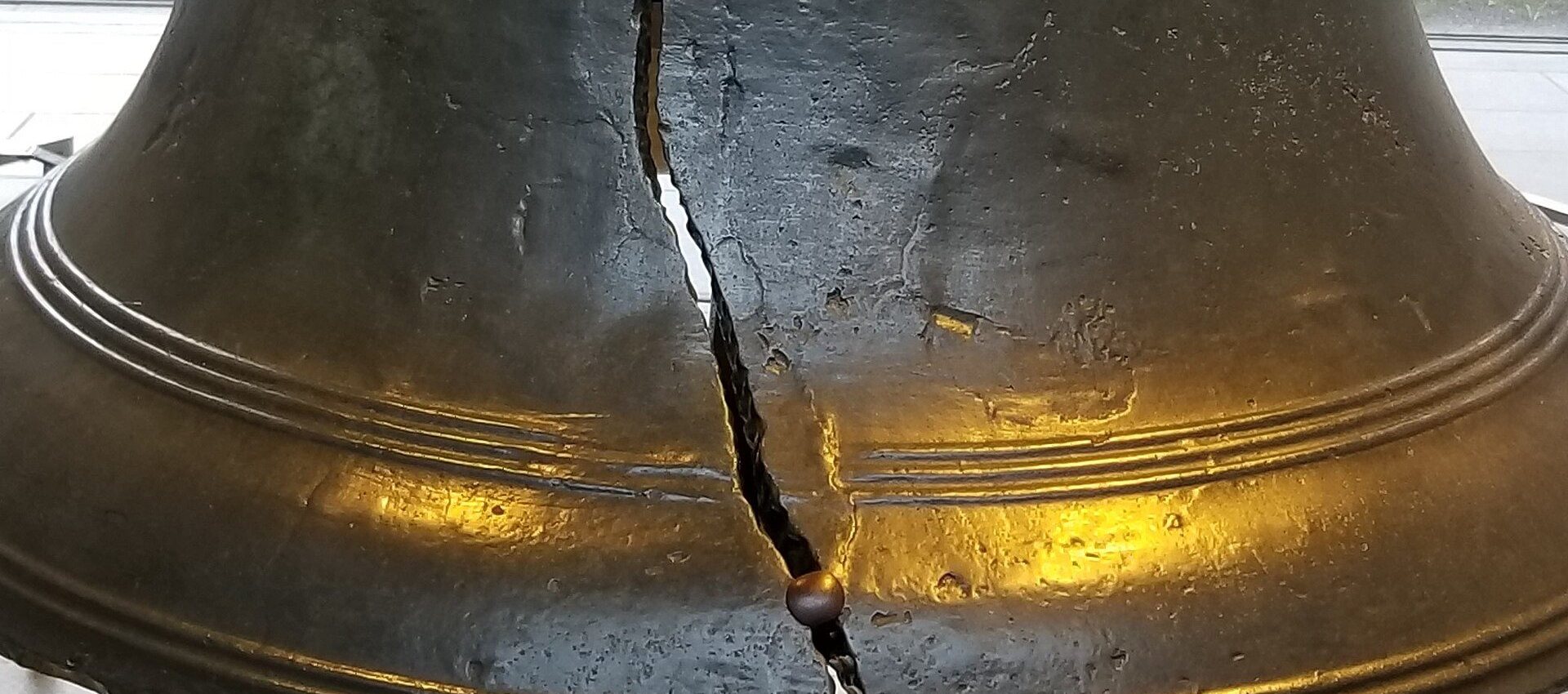 Close view of the crack running through the lip of the Liberty Bell.